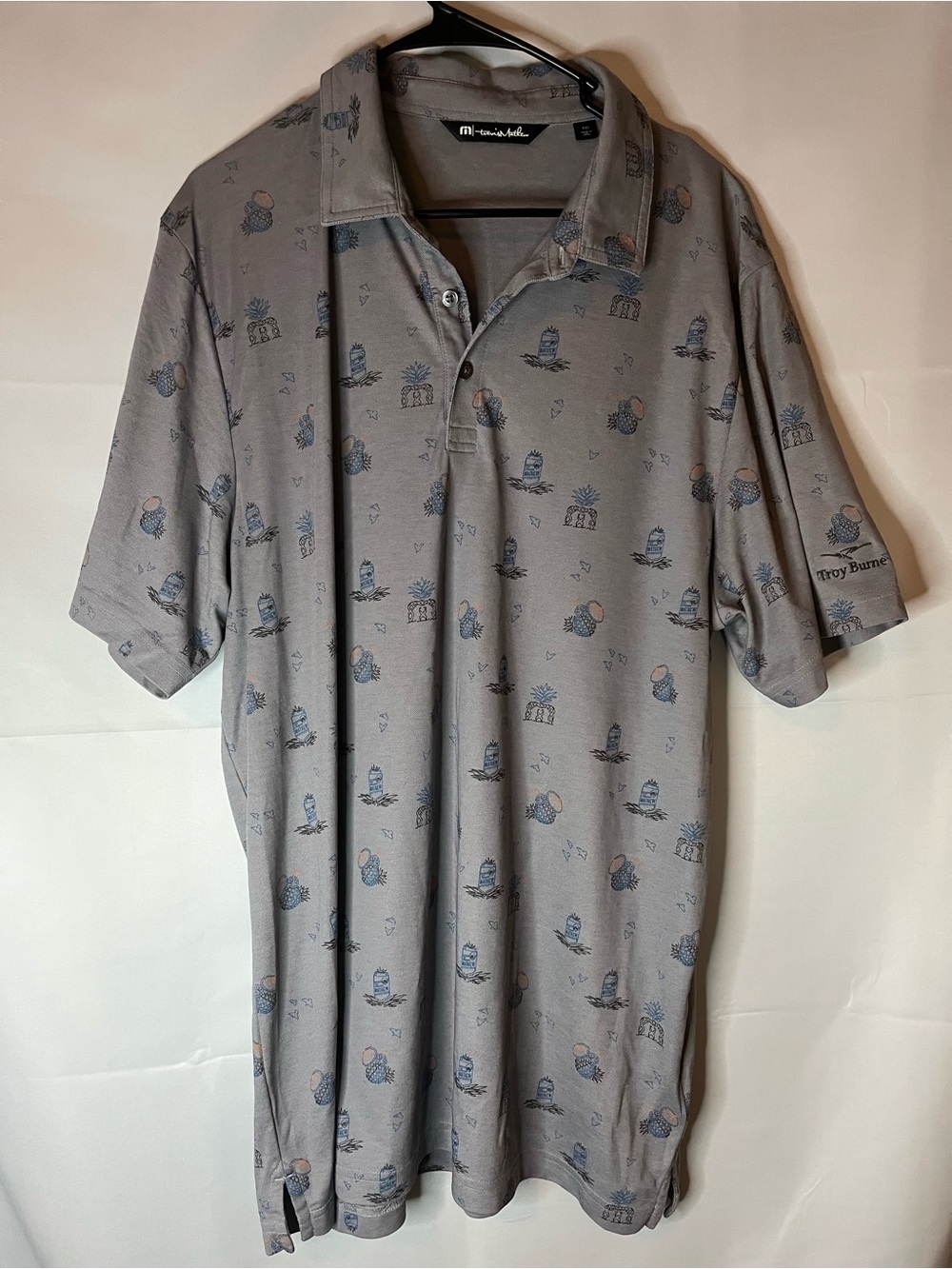 Travis Mathew Light Gray Polo with Pineapple Design